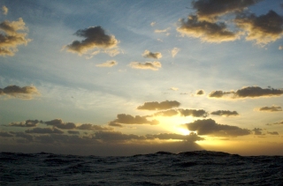 Sunset vista offshore in the Pacific with swell